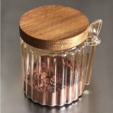 Set of three wooden and glass kitchen jars