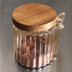 Set of three wooden and glass kitchen jars